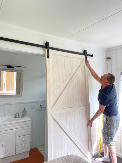 Frederick Handyman installing new barn door