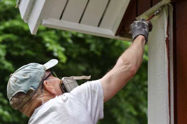 Alban Handyman Services painting home exterior.